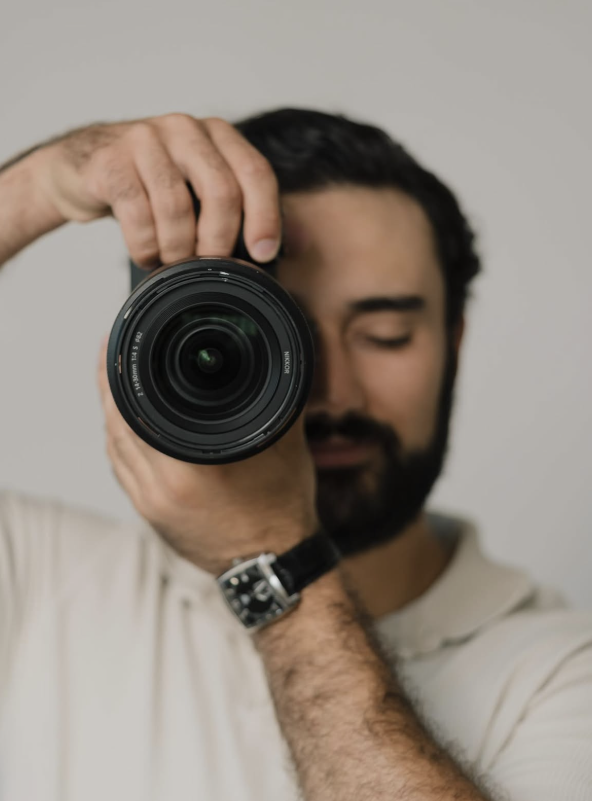 Zach Uthman holding a professional camera
